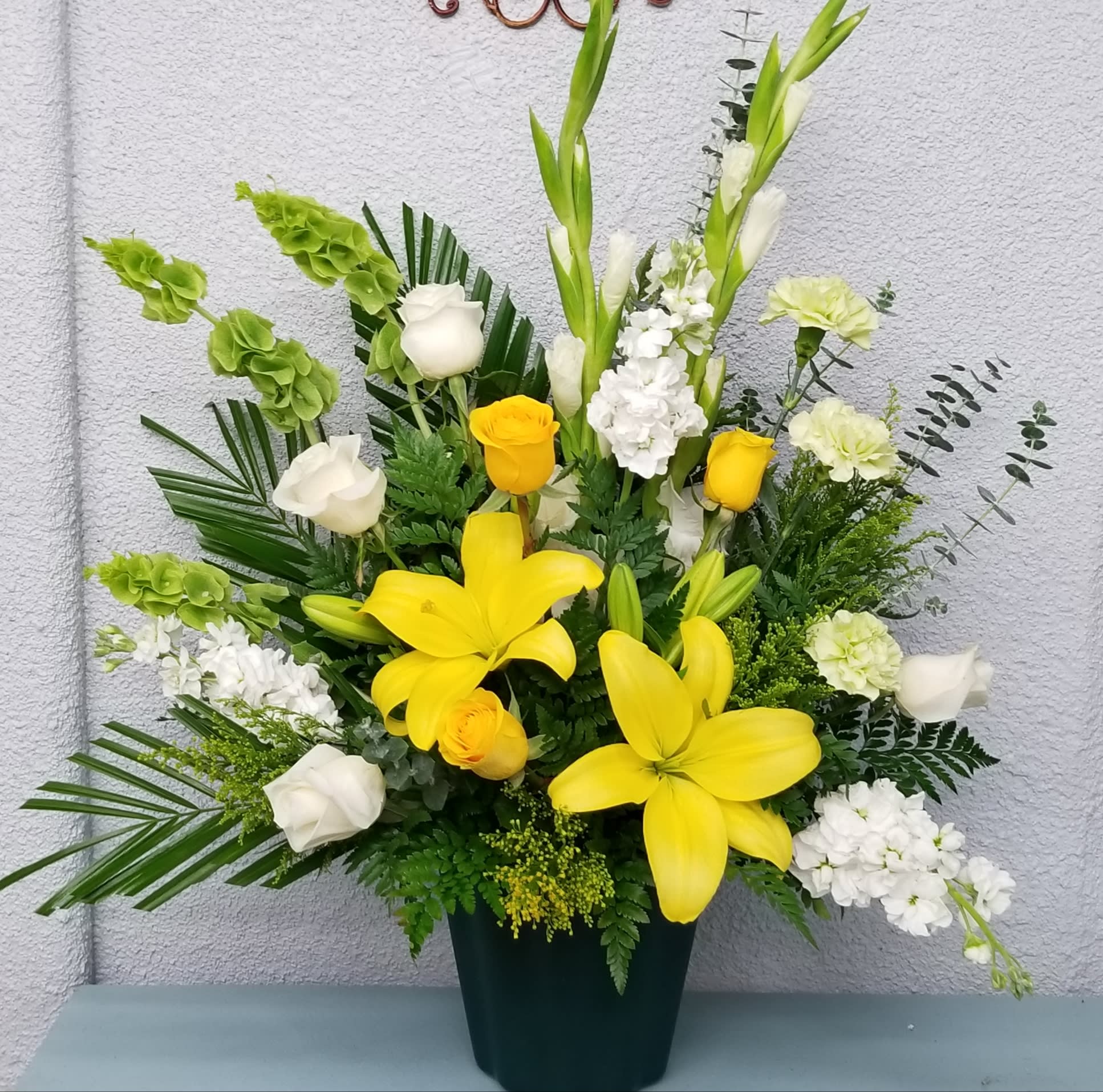 Yellow White Sympathy Arrangement In St George Ut The Flower Market At the passing of a friend or family member, flowers can serve as an ideal tribute to the memory of the deceased. yellow white sympathy arrangement in st george ut the flower market