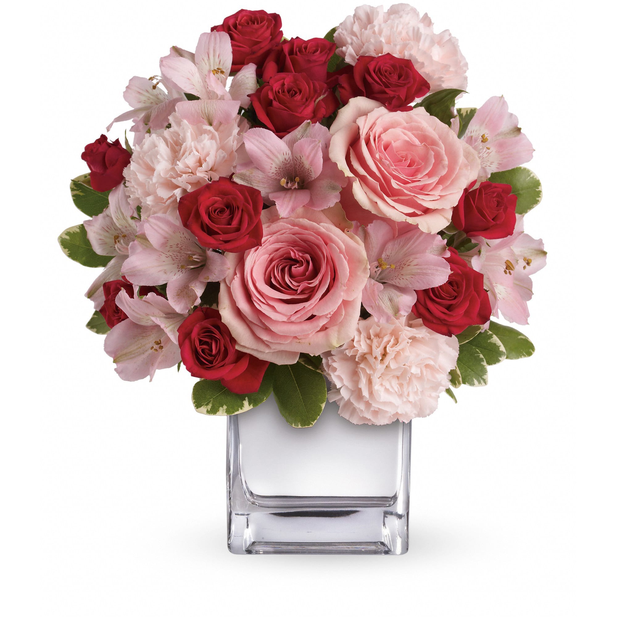 Teleflora's Love That Pink Bouquet with Roses - Passionately pretty in pink, this gorgeous array of pink and red roses and other favorites in a chic mirrored silver cube is a guaranteed heart-winner. She'll be thrilled with the gift, and knocked out by your impeccable taste.  