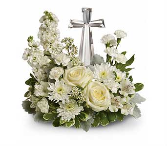Divine Peace Bouquet - Lush white funeral flowers surround a beautiful crystal cross in this stunning all white funeral bouquet. The Christian arrangement is appropriate to send to the church or funeral home as a heartfelt, religious statement of peace and divinity.