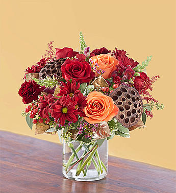 Vintage Autumn Blooms - Our vintage-inspired arrangement captures that old- world charm with a gathering of blooms in rich, warm tones combined with rustic, natural touches. 
