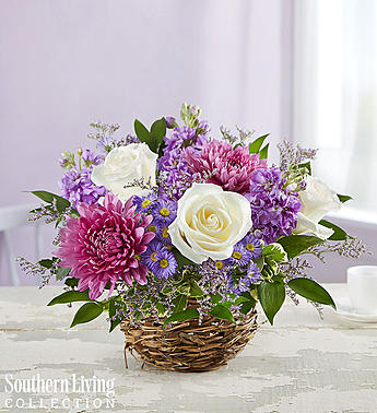 Lavender Delight™ by Southern Living™ -  Designed exclusively in partnership with Southern Living, our darling arrangement of lush blooms in hues of lavender, pink, and white burst forth from our rustic bird’s nest container. It’s a unique and lovely spring gift that will bring joy to whomever receives it.