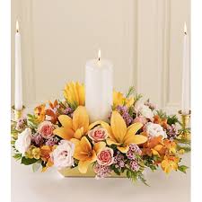 Infinite Love™ Unity Candle Arrangement - Designed to hold the Unity Candle, this arrangement of peach Asiatic lilies, mango Mokara orchids, pink lisianthus and peach spray roses encircles a 9&quot; white pillar candle, with a 12&quot; white taper candle on either side.