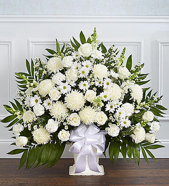 Heartfelt Tribute™ Floor Basket- White - There’s a feeling of peace and tranquility that white flowers can bring to those who are grieving. Our elegant all-white floor basket, handcrafted by our caring florists with lush white blooms, is a tasteful gesture perfectly suited for the funeral home or memorial services.