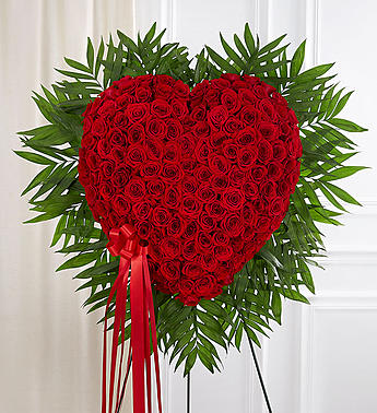 Red Rose Bleeding Heart - When words alone aren’t enough to express the strength of your love, this impressive heart-shaped arrangement makes an unforgettable statement.  Handcrafted by our caring florists using red roses in a solid heart shape, it’s a beautiful tribute best suited for the funeral services.