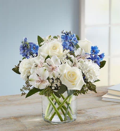 Wonderful Wishes Bouquet - Our rustic, easy bouquet in shades of blue and white captures every wish you want to express to those who mean the most. Hand-designed inside a clear cylinder vase, it’s a gift that won’t leave them wondering how you much you care.