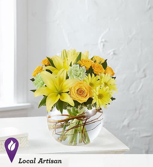   Smiling Surprise™ Bouquet - Here’s a bright way to send a happy surprise! Our new vibrant bouquet is gathered with cheerful yellow blooms and unique curly willow tips inside a charming, petite bubble bowl. 