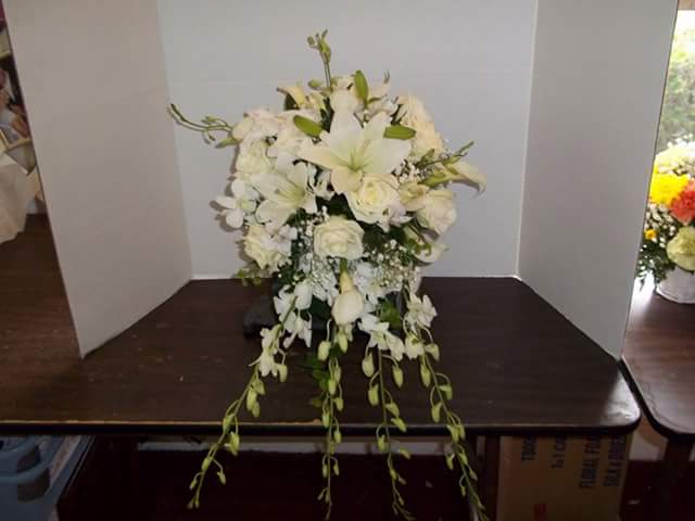 Orchid bride surprise - Dendrobium orchids and white oriental lilies make this a stunning cascading bridal bouquet.  Add in white roses and calla lilies for the added touch of elegance.