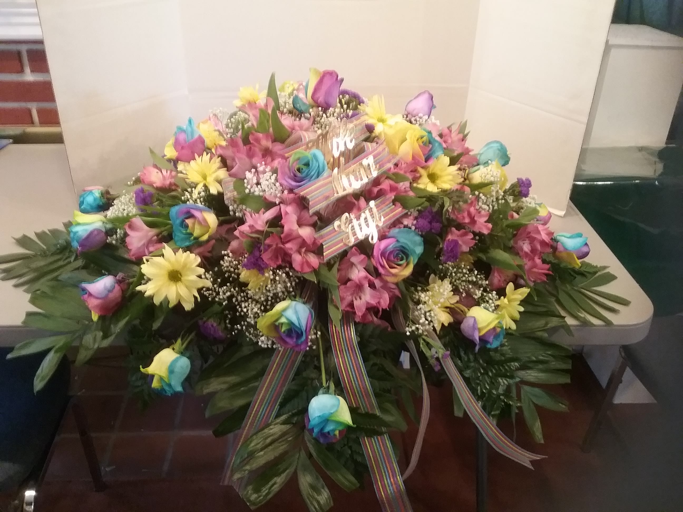 Peace lovers dream - Multicolored dyed roses and yellow daisies are fitting for those that want something unique.