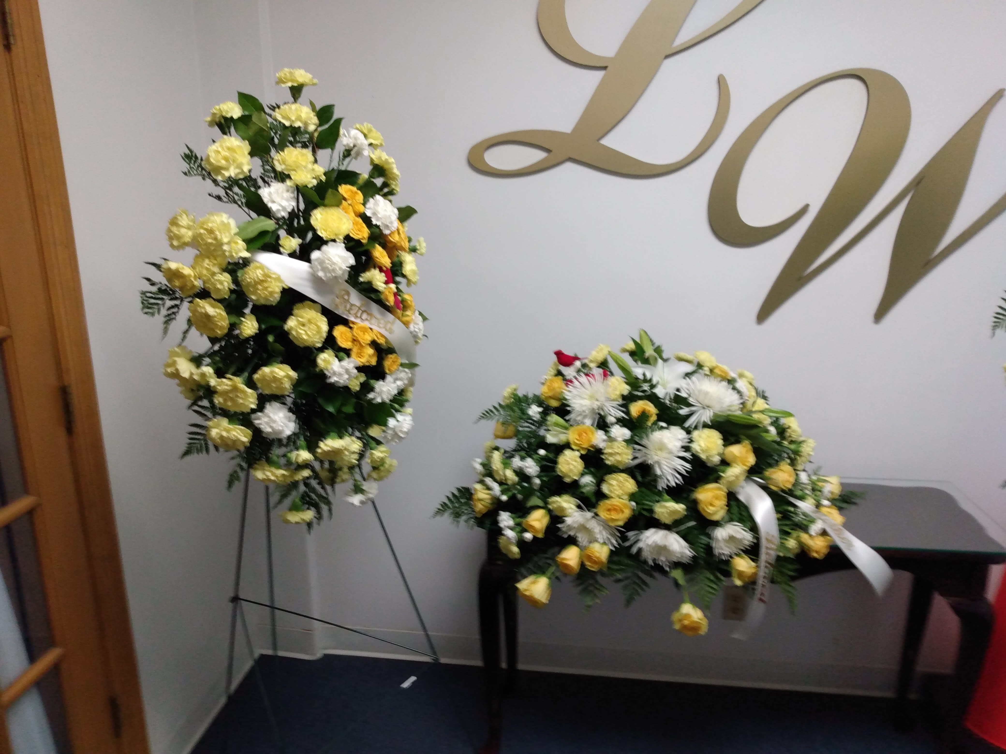 EBS affordable package - One standing spray and one casket spray with roses carnations and Spider-Mums color of your choice