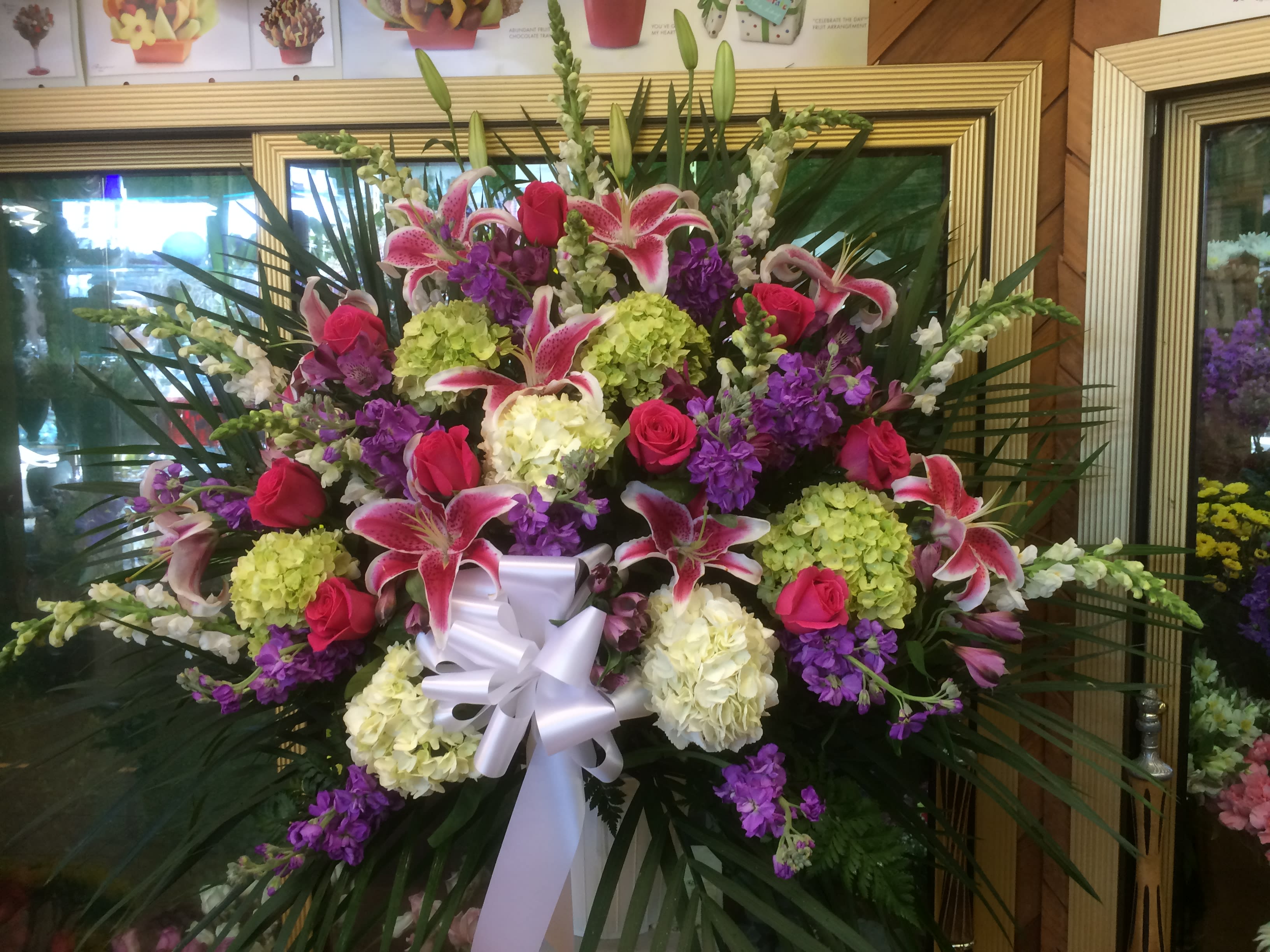 Multi Color Pastel Standing Basket - Standing basket with a variety of pastel colored flowers.
