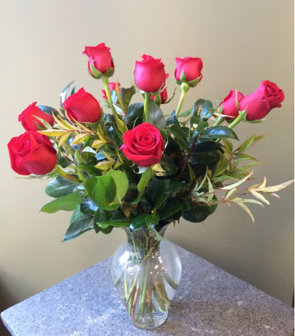 Dozen Medium Stemmed Roses - A Dozen Beautiful Medium Stemmed Roses in a clear glass vase with assorted greenery. PLEASE SPECIFY COLOR Approximately 18&quot; to 20&quot; tall