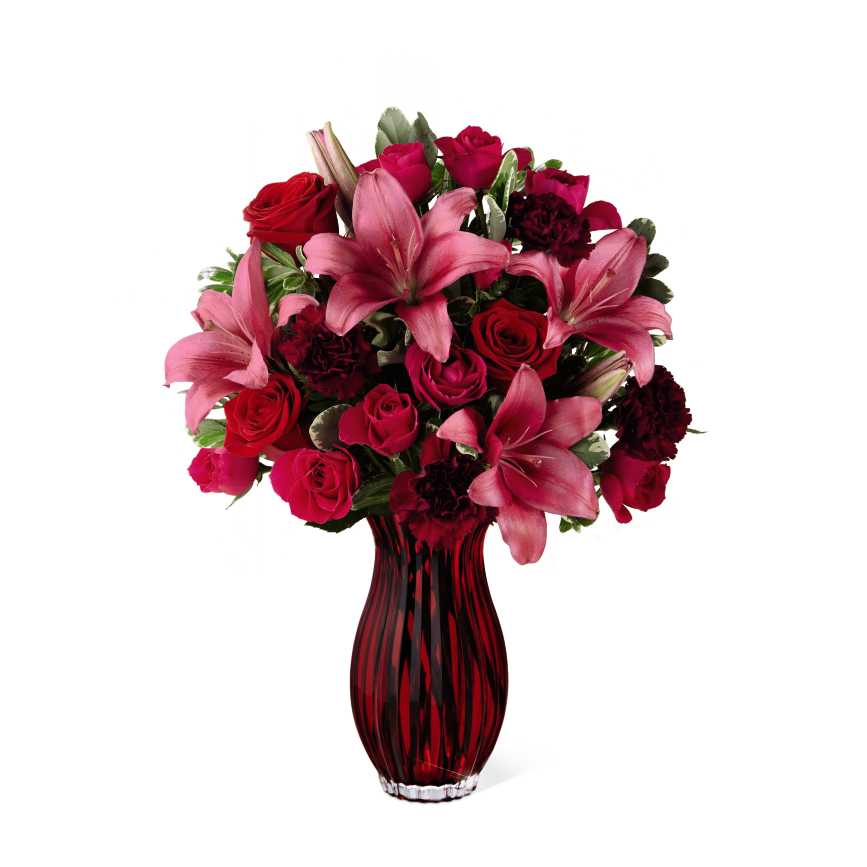FTD Lasting Romance Bouquet - The FTD Lasting Romance Bouquet beautifully reflects all your love and affection with classic Valentine's Day grandeur. Rich red roses, eye-catching dark pink LA Hybrid Lilies, hot pink spray roses, and burgundy carnations are accented with lush, fragrant greens in an heirloom quality vase of sparkling red glass. It makes a uniquely elegant way to express whats in your heart, this coming February 14th.