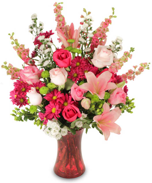 CF2007 - Hopeful Happiness Send joy with this charming bouquet featuring a lush assortment of Light Pink Roses, Hot Pink Roses, Pink Lilies, Fuchsia Daisy Mums, Pink Larkspur, White Monte Casino Aster, Green Button Mums, Green Hypericum, and foliage artfully arranged in an elegant pink vase.   Copyrighted content provided by FlowerShopNetwork.com Proud Member of Flower Shop Network