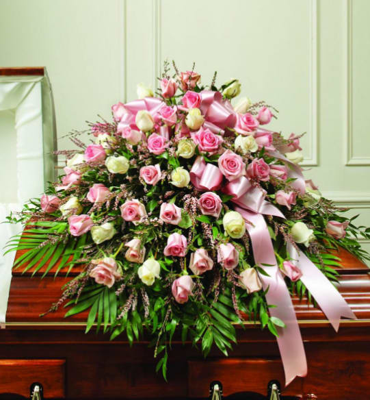 BNP04 - Celebrate and remember a loved one in a beautiful and feminine way. Our Pink &amp; White Casket Spray is artistically arranged and will elegantly drape half of the casket. It is a meaningful and sincere final tribute. 
