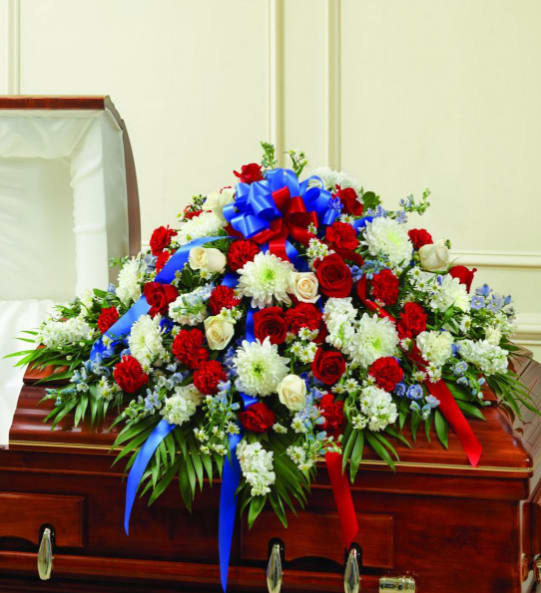 BNPT3 - Red, White &amp; Blue Sympathy Casket Spray Celebrate and honor a dearly departed in the most patriotic way. Our Red, White &amp; Blue Casket Spray is expertly arranged with fresh flowers and will drape half of the casket beautifully. This exquisite piece will bring comfort to friends and family. 