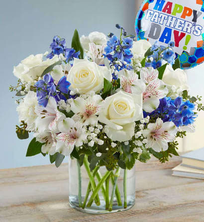 Best Dad Bouquet - Our rustic bouquet in shades of blue and white captures every heartfelt wish you want to express this Father’s Day. Hand-designed inside a clear cylinder vase, and paired with a festive balloon, it’s a gift to celebrate the wonderful man he is, today and every day.