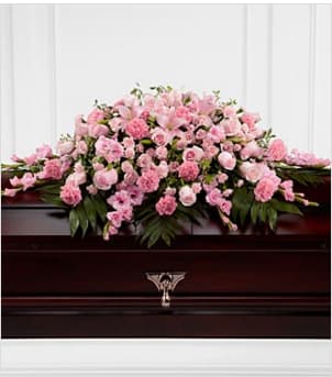 The FTD® Sweetly Rest™ Casket Spray The FTD® Sweetly Rest™ Casket Spray - The FTD® Sweetly Rest™ Casket Spray is a wonderful way to commemorate a life abundant in beauty and love. Blushing pink roses, spray roses, carnations, gladiolus, mini carnations and Asiatic lilies are elegantly arranged amongst an assortment of lush greens to create a sophisticated display meant to bedeck the top of thier casket at the final memorial service. Approximately 48"W x 38"D. Your purchase includes a complimentary personalized gift message.