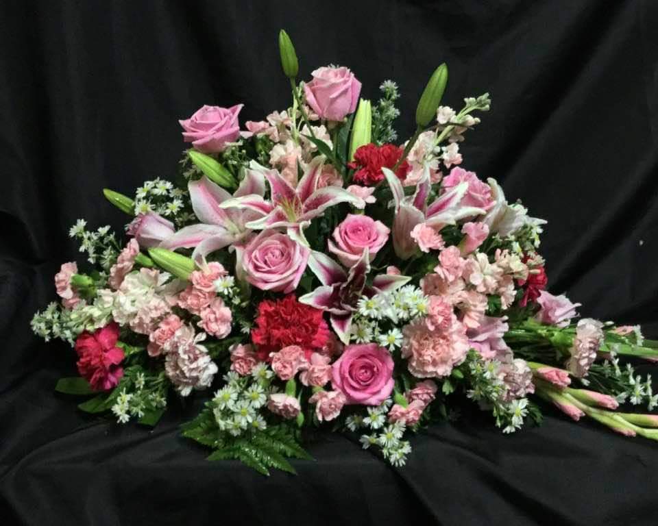 GARDEN OF LOVING MEMORIES GARDEN OF LOVING MEMORIES - Honor your departed and bring grace and beauty to the memorial service.This BEAUTIFUL casket spray is 30 by 22 for a standard size