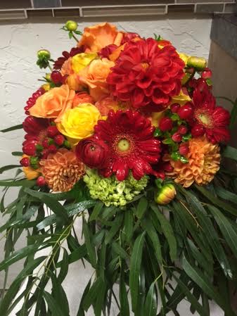 Bridal Bouquet Bridal Bouquet - roses, gerbs dahlia ranunculus , berries in oranges yellow and reds accented with willow