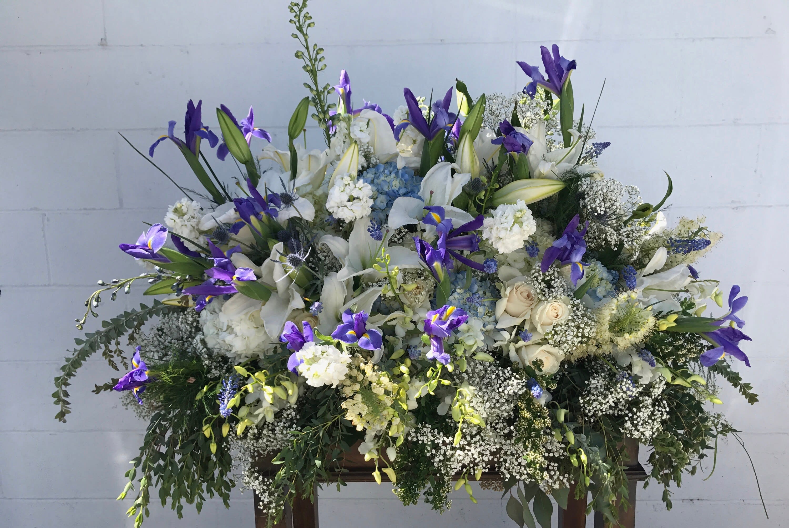 The Old Fashion - Large spray of Iris flowers that is placed on the top of the casket.   Must pre-order this arrangement in advance.
