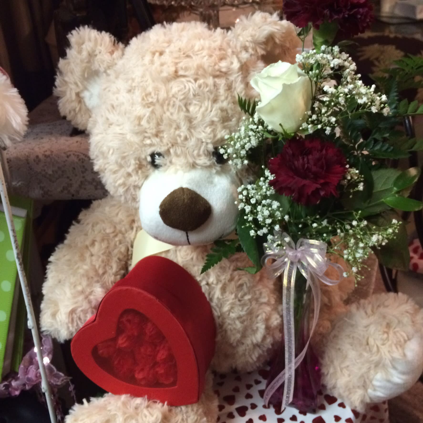 Be Mine Be Mine - Teddy Bear adorned with a heart box of assorted chocolates and s mixed arrangement of Valentine Flowers