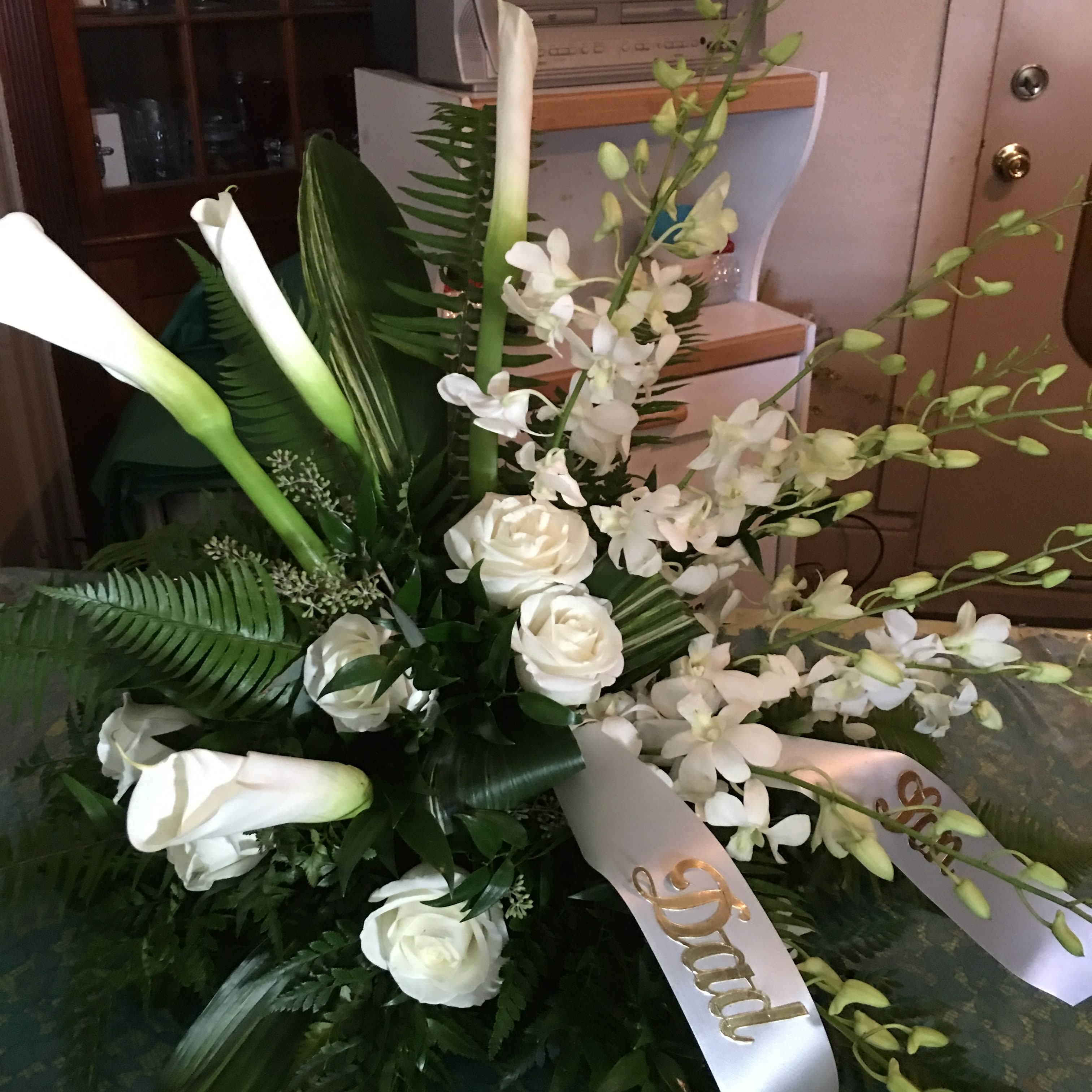 white casket spray - Cala lilys white roses and orchids