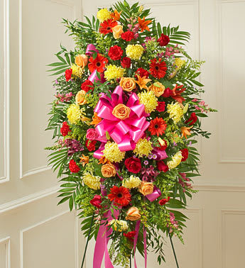 Bright Standing Spray Tribute Bright Standing Spray Tribute - Crafted from fresh and brightly colored blooms, our heartfelt standing spray is a beautiful symbol of your love and support. Gathered with roses, lilies, Gerbera daisies, mums, snapdragons, alstroemeria, carnations and more, let it convey your deepest sympathies and let them know they’re in your thoughts.