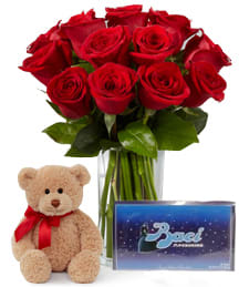 1 Dozen Long Stem Red Roses with Bear & Perugina Baci Finest Italian Chocolates - VASE INCLUDED 1 Dozen Long Stem Red Roses with Bear & Perugina Baci Finest Italian Chocolates - VASE INCLUDED - 12 Long stem red roses are gorgeously presented among lush greens with a classic clear glass vase. Accompanied by a 10-inch seated plush bear and Long stem red roses are gorgeously presented among lush greens with a classic clear glass vase. Accompanied by a box of Perugina Baci Finest Italian Chocolates