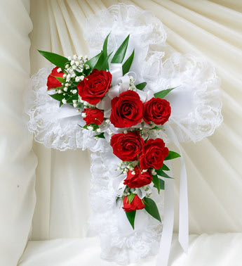 Red &amp; White Satin Cross Casket Pillow - Children and grandchildren can express all the love, sympathy and compassion they feel at this difficult time with this touching tribute. A cross-shaped pillow is adorned with red spray roses and more, for a timeless expression of faith, hope and love.