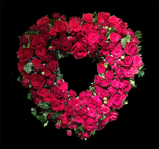 Roses Forever AF6 - Red Roses are paved into a heart form and presented on a wire easel stand. Perfect the any memorial location.