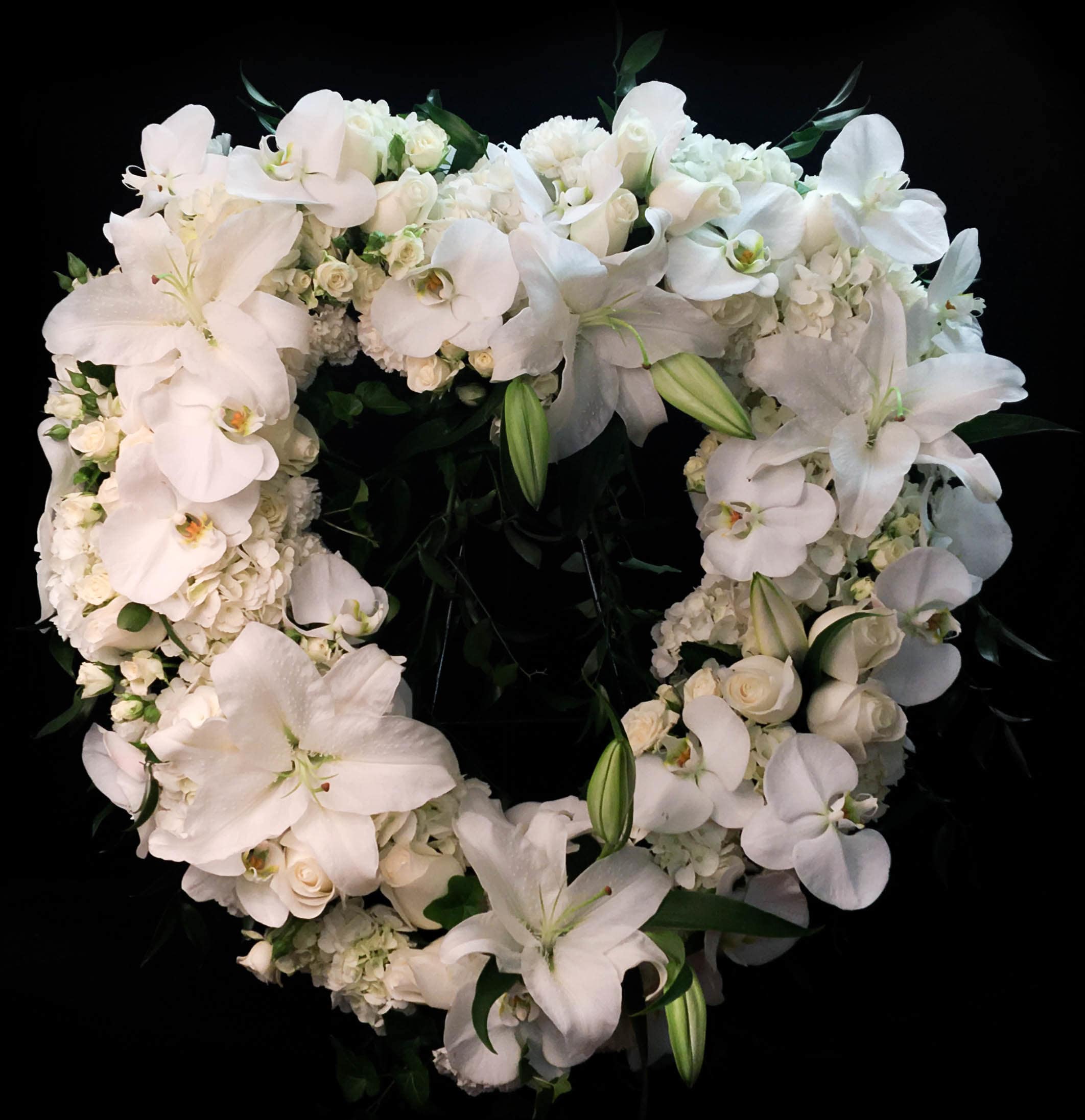 Precious Heart AF1 - Mixture of the ultimate peace, all white seasonal flowers in a heart shape.