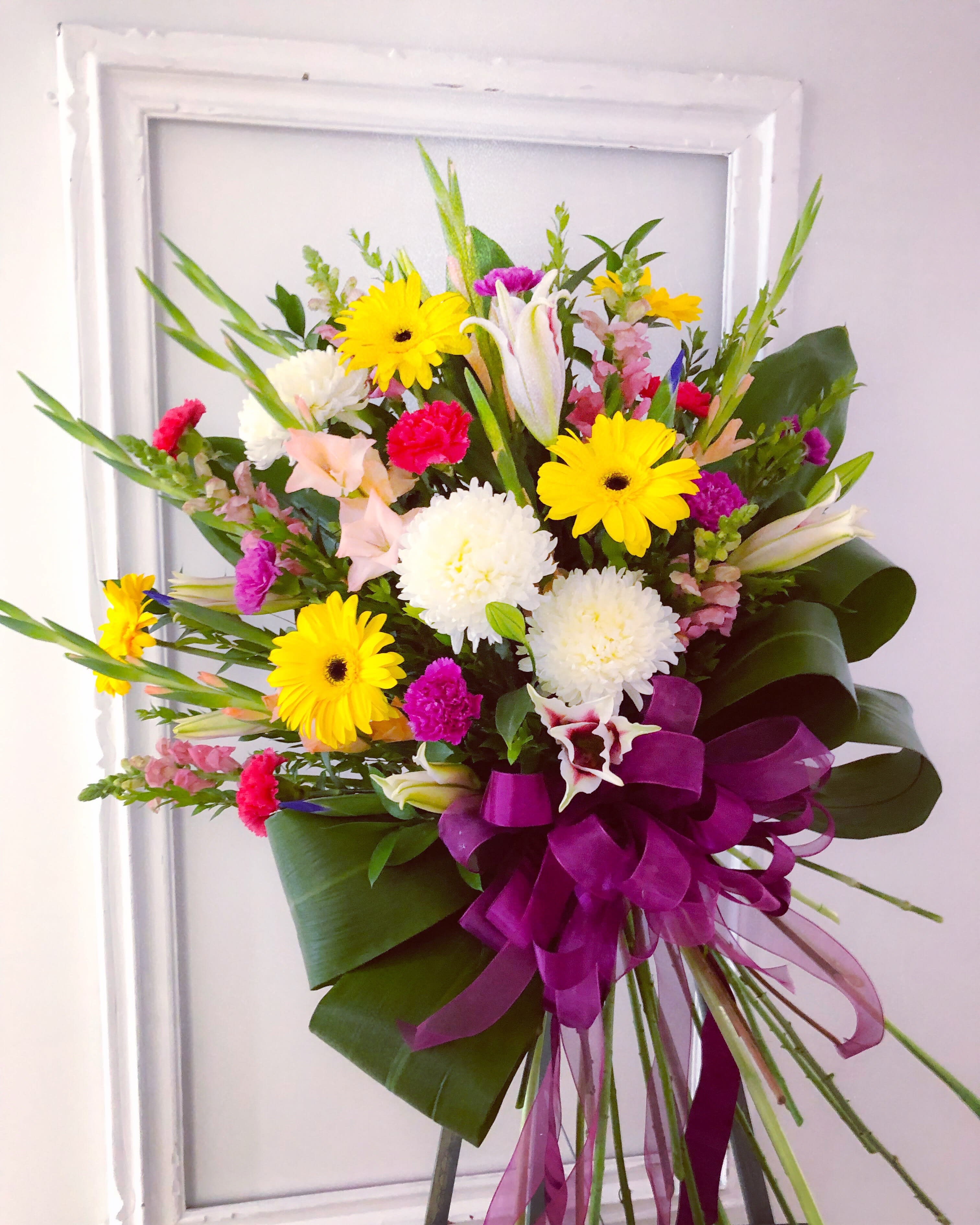 Loving Bouquet Standing Spray - A bright mixed flower bouquet created in appreciation and gratitude for your loved one.   (Regular - Approximately 36&quot;H x 34&quot;W) (Deluxe - Approximately 38&quot; H x 35&quot; W) (Premium - Approximately 40&quot;H x 36&quot;W)