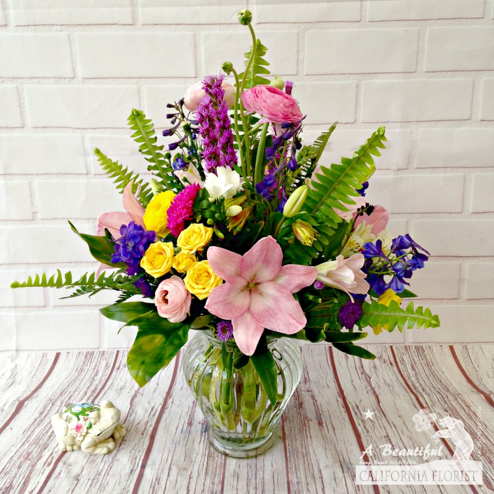 Spring Fling! Celebrate Spring and enjoy these fun blooms  - Sunshine, Springtime, Funtime, Anytime... is the right time for Spring Fling arrangement! Great for a Spring, Easter and Passover, get well, or just because! This is a mixed arrangement, our artisans will create from the freshest blooms available that day, so expect variations from the picture. Order and enjoy Spring Fling today!