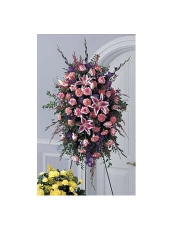 Precious Standing Precious Standing - A lavish standing spray in pink and lavender tones. Pink roses Stargazer lilies carnations and heather are combined with purple gladiolus Matsumoto asters Monte Casino and statice. Delivered on an easel this one-sided design is appropriate for the funeral home or memorial service. FCS11-3794