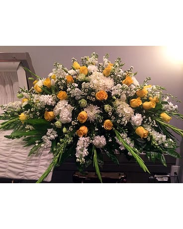 Peaceful Light Casket Cover Peaceful Light Casket Cover - Yellow rose accents together with white hydrangeas stock snaps tulips lisianthus white monte casino gladiolas fujis carnations.Flowers may vary depending on availability. FCF-540