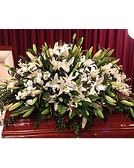 Lovely White Casket Spray Lovely White Casket Spray - White lilies white stock and other filler. FCF-0106