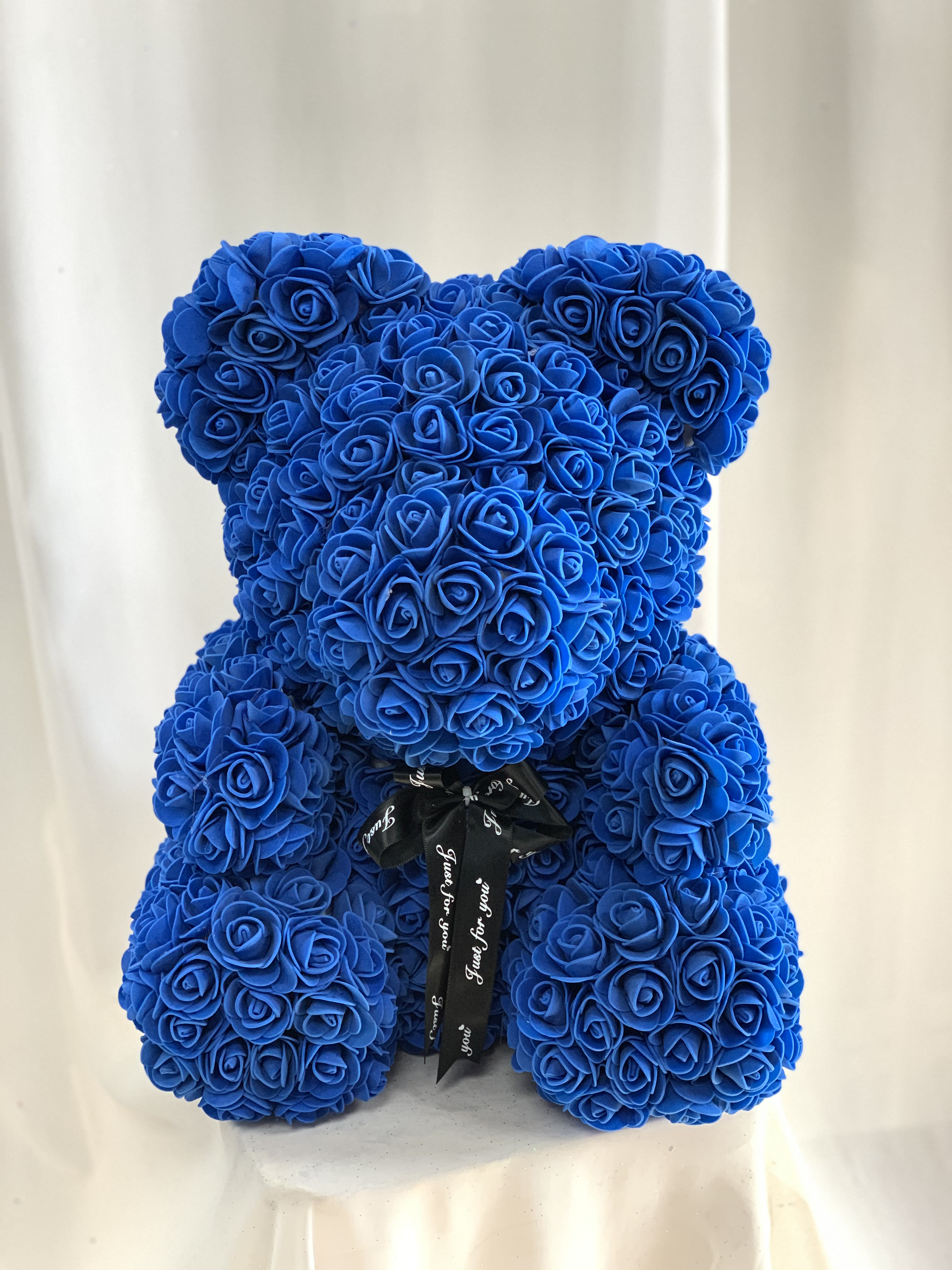 Faux Blue Rose Teddy Bear by Four Season Florist and Gifts