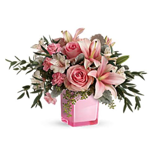 Fabulous Flora - Just fabulous! From its perky pink cube and perfect pink roses, to its textural greens and dramatic pink lilies, this chic bouquet is flora at its finest! This gorgeous bouquet features pink roses, pink asiatic lilies, white alstroemeria, pink miniature carnations, dusty miller, parvifolia eucalyptus, and seeded eucalyptus. Delivered in Teleflora's Rose Color Splash Cube. Orientation: All-Around