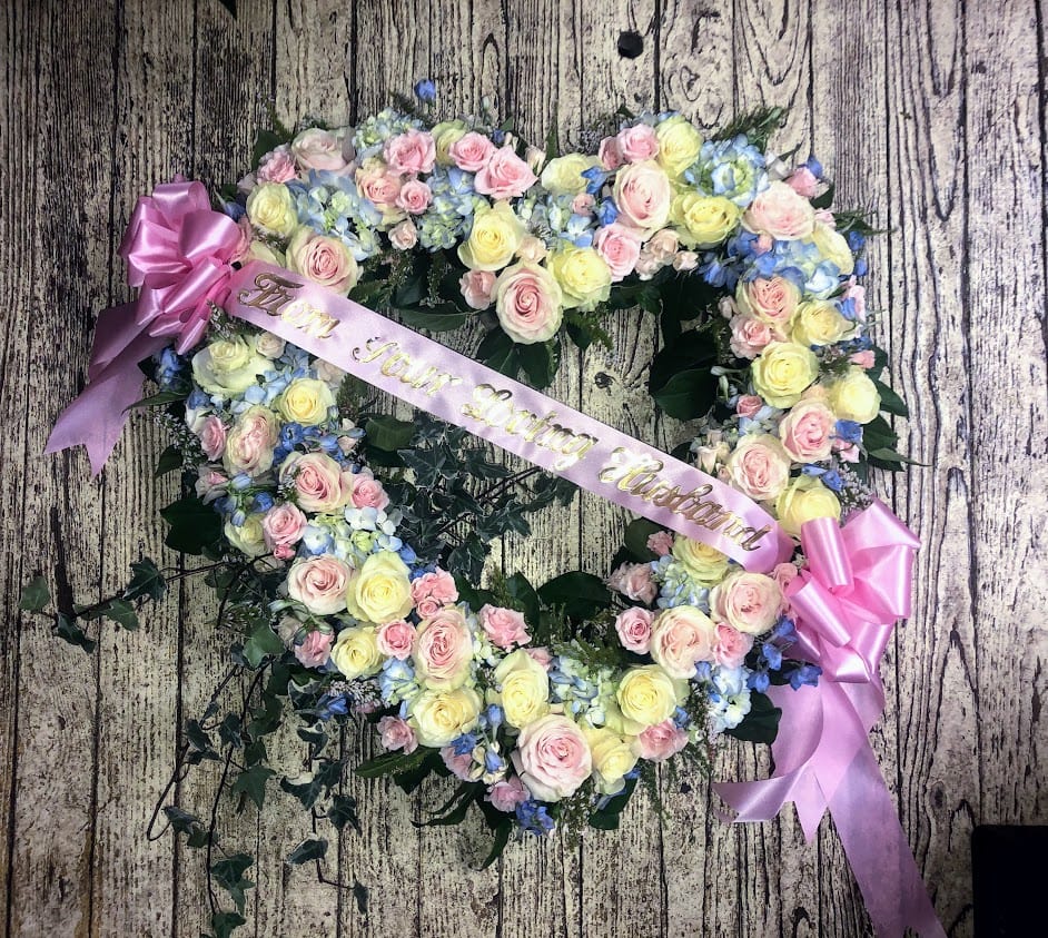Rose and Hydrangea Heart - 24&quot; Open Heart filled with hydrangea, roses and delphinium accented with greenery.  Other Colors Available  Call for additional sizes and Pricing  732-899-8175