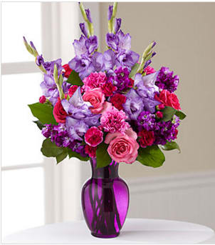 The FTD® Sweet Thought™ Bouquet - Celebrate a life well-lived with this colorful floral tribute. Handcrafted by a local FTD artisan florist, this arrangement is just right for delivering your message of sympathy at a wake, funeral or to comfort grieving family or friends at home. A vibrant composition of mixed flowers in spring and summer colors combines pink roses and carnations, purple stock and gladiolus arranged in a purple glass vase.  Your purchase includes a complimentary personalized gift message.