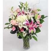 Garden Delight - An assortment of Lilies, roses, carnations, snapdragons, larkspur, stock and daisy poms and assorted fillers make up this beautiful garden bouquet