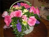 Garden Basket Arrangement - Fresh cut flowers of roses, carnations, daisies and assorted fillers bring joy and light in this basket