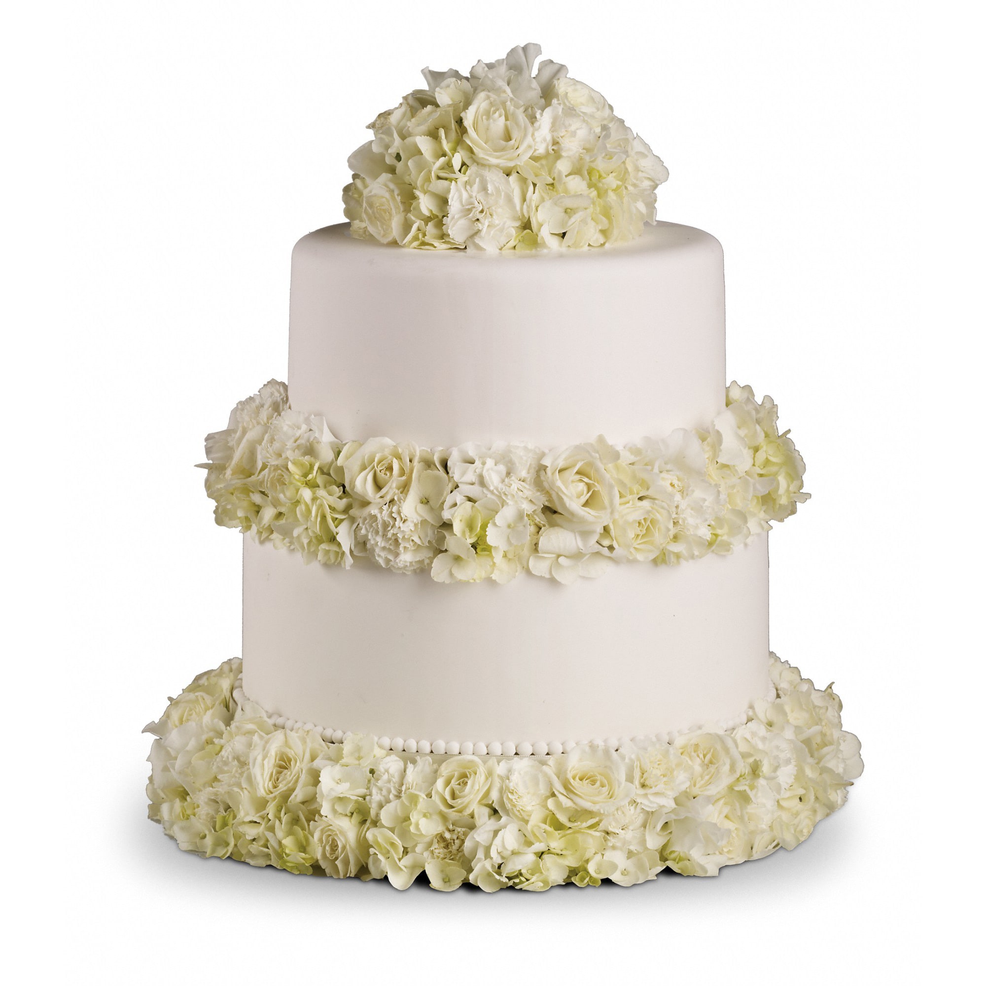 Sweet White Cake Decoration - Simple. Sweet. Sensational! Featuring white roses, hydrangea and mini carnations.    A delightful array of white roses, carnations and hydrangea.    Approximately 14 1/2&quot; W x 17 1/2&quot; H    Orientation: All-Around        As Shown : T189-3A    