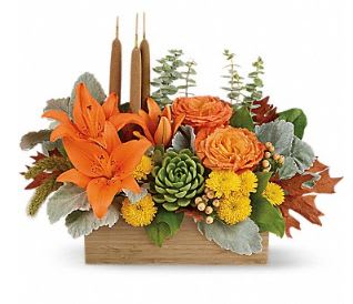 Fall Bamboo Garden  - This trendy fresh floral arrangement enchants in shades of peach, orange and green and features orange roses, trendy succulents, orange asiatic lilies, yellow cushion spray chrysanthemums, peach hypericum berries, millet, cattails and is finished with fall greenery and autumn oak leaves!  Created in a natural bamboo rectangle this contemporary fresh floral design is perfect for a birthday, hostess gift, get well wish, anniversary, holiday or Thanksgiving, boss's day, best friend, thank you or just because!  Available for same day delivery to Washington Park, Belcaro, Cory-Merrill, University Park, Virginia Village, Platt Park, Cherry Creek, Denver Country Club and most Denver neighborhoods by Denver's Best Florist, Floral Expressions!  