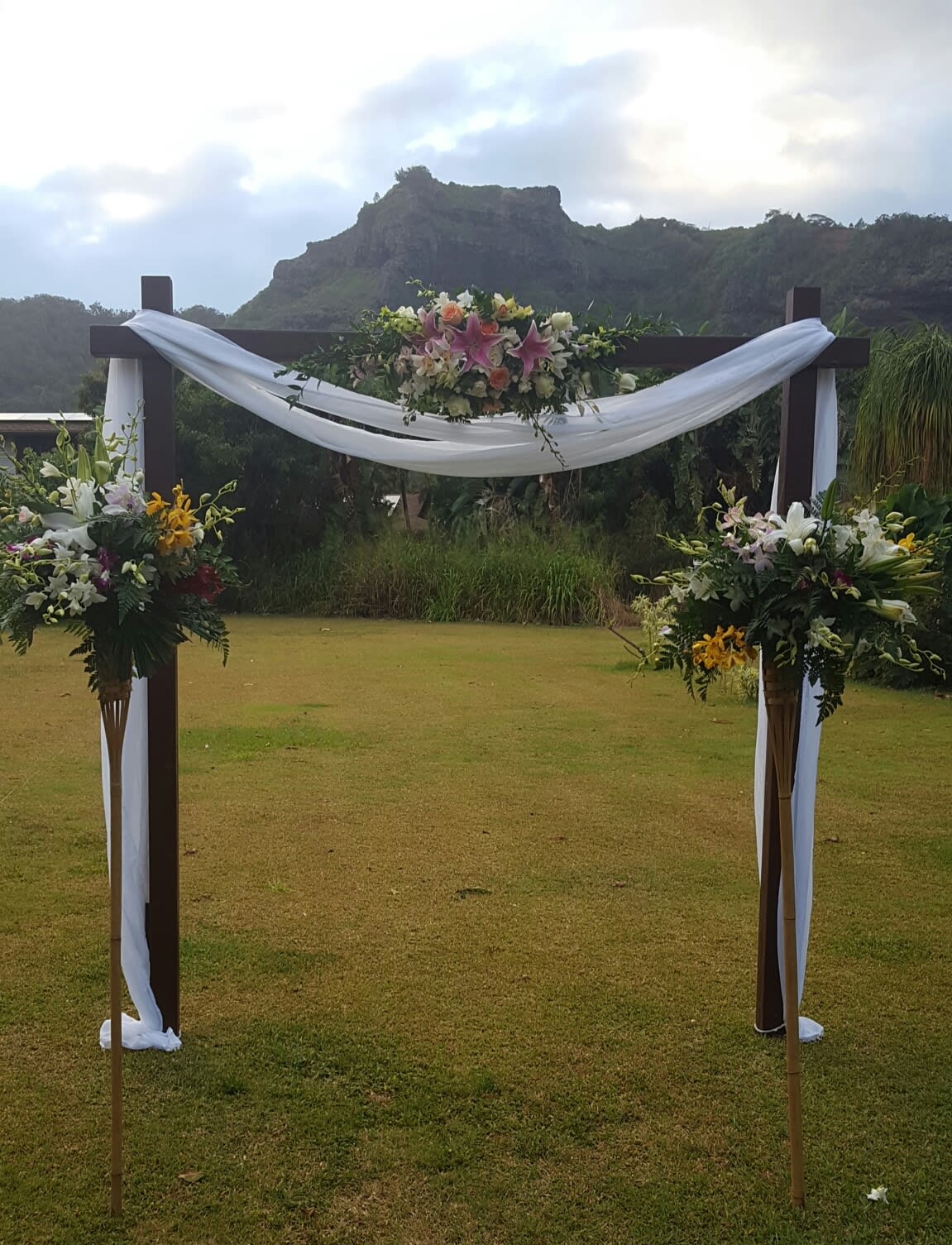 WOOD ARCH & 2 TIKI TORCH SPRAYS in Lihue, HI Flowers Forever LLC