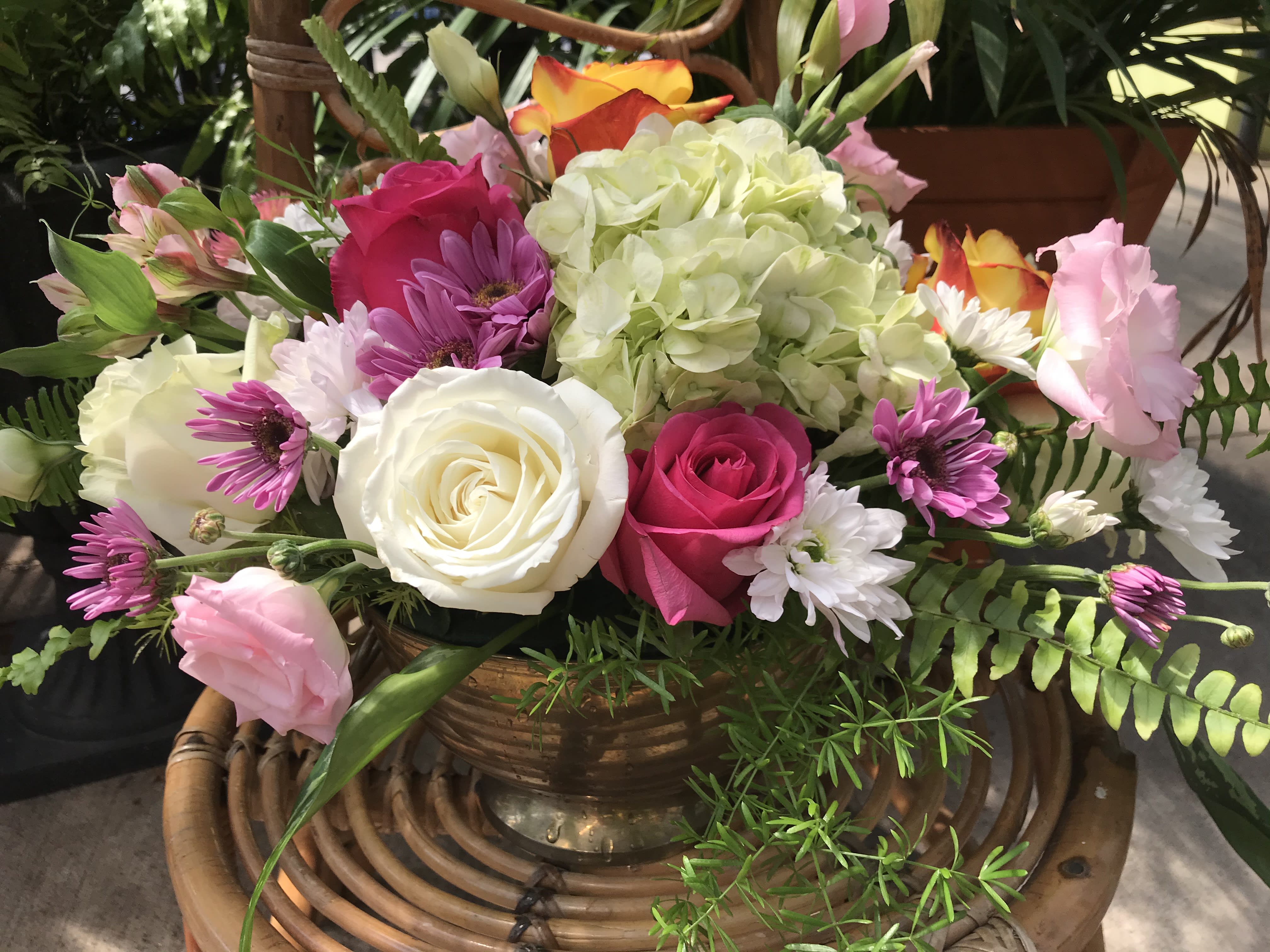 Softer tones. - A perfectly beautiful, fresh designer arrangement. We include a selection of beautiful greens from our greenhouses and combine it with seasonal blooms. Perfect gift for a friend or family member on their special occasions.
