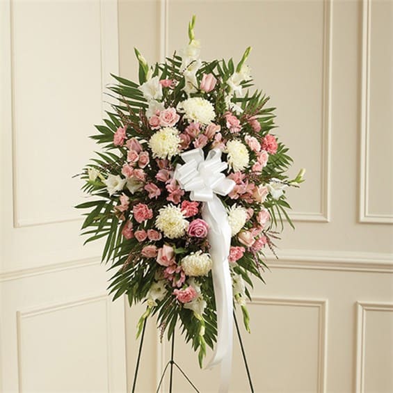 Pink &amp; White Sympathy Standing Spray - This Sympathy Standing Spray, in shades of peach, orange and white, is a beautiful symbol of your sympathy and support. Pink roses, stargazer lilies, spray roses, white carnations and more An appropriate gift for family, friends and business associates to send directly to the funeral home Our florists use only the freshest flowers available so colors and varieties may vary Large measures approximately 54&quot;H x 42&quot;L Medium (shown) measures approximately 46&quot;H x 38&quot;L Small measures approximately 42&quot;H x 32&quot;L 