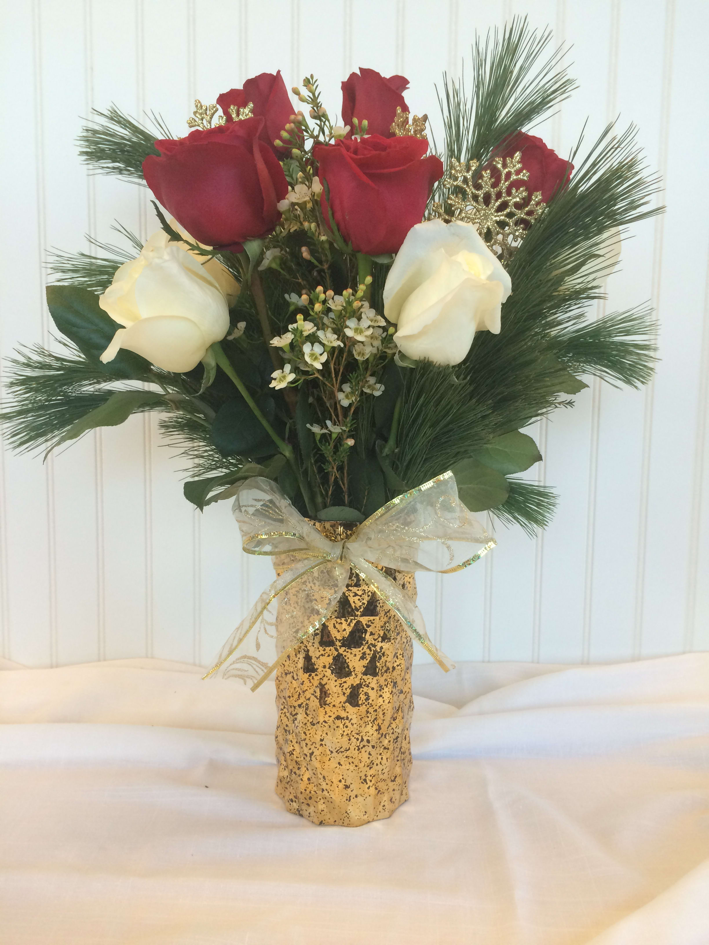 Love is our Greatest Gift Love is our Greatest Gift - A gorgeous golden vase with beautiful red & white roses, fresh evergreens & gold accents