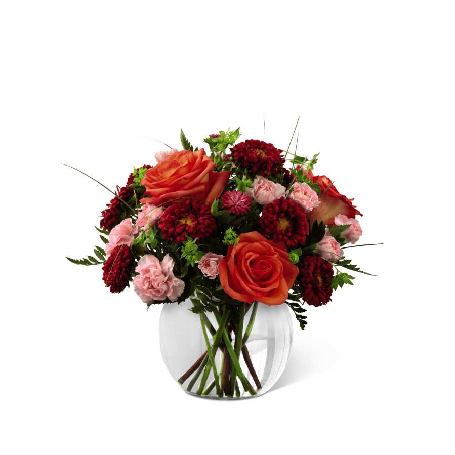 The FTD Color Rush Bouquet by Better Homes and Gardens - FTD proudly presents the Better Homes and Gardens Color Rush Bouquet. A sweet symphony of bold color, this bouquet of orange roses, red matsumoto asters, pale pink mini carnations and lush greens create an impressive statement. Arranged in a clear glass bubble bowl, this bouquet will spread smiles at every turn. GOOD bouquet includes 8 stems. Approx. 11âH x 12âW. BETTER bouquet includes 12 stems. Approx. 12âH x 13âW. BEST bouquet includes 16 stems. Approx. 13âH 14âW.