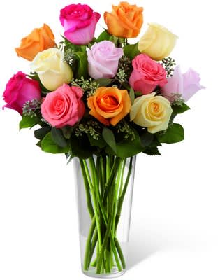 The FTD® Graceful Grandeur™ Rose Bouquet - E8-4810  The Graceful Grandeur™ Rose Bouquet by FTD® offers your special recipient a bright assortment of roses to bring them joy with its exquisite beauty. Cream, orange, hot pink, coral and light pink roses are accented with lush greens and gorgeously arranged within a clear glass vase to create a lovely way to send your love, say thank you, or even to extend your happy birthday wishes.